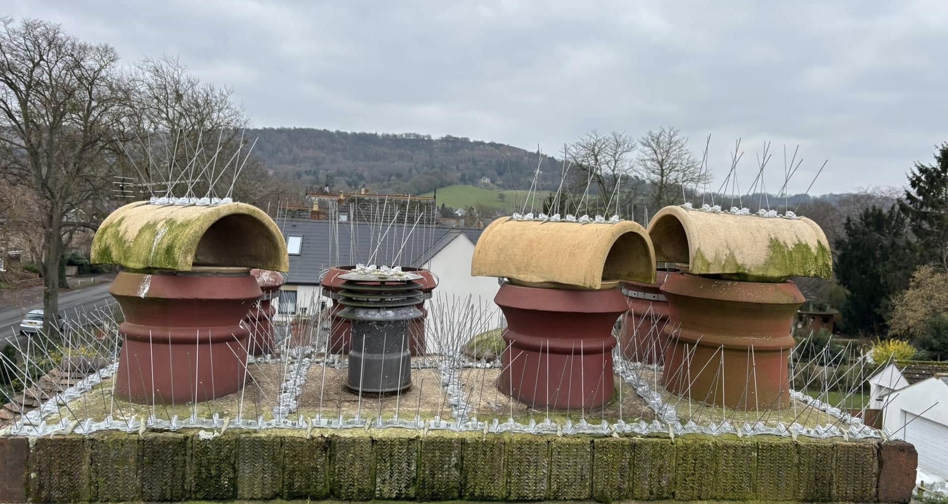 Bird spikes on a chimney stack